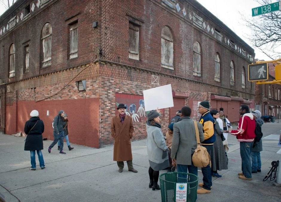 Historian and preservationist Michael Henry Adams, center, leading a demonstration against razing the Renaissance Theater and Casino in Harlem. Photo: Bryan R. Smith for The New York Times (December 19, 2014)